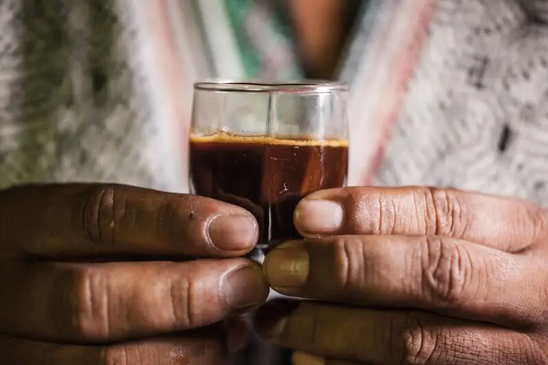 Hands holding a ceremonial cup